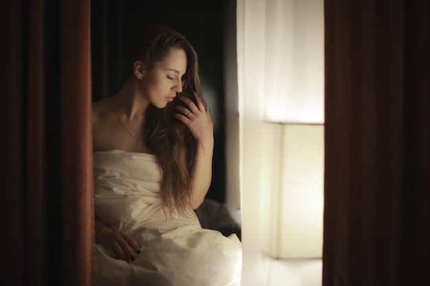 glamor portrait of a girl hotel window