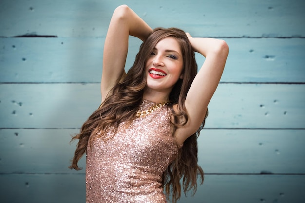 Glamorous brunette against painted blue wooden planks