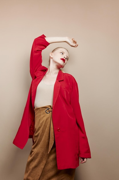 Glamorous woman makeup in red jacket studio model unaltered
