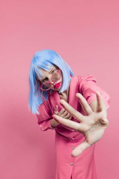 Glamorous woman in sunglasses wears a blue wig makeup Lifestyle posing