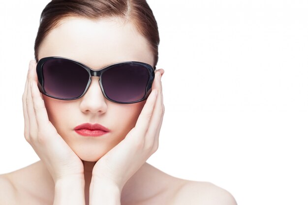 Glamorous young model wearing stylish sunglasses 