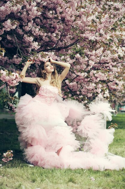 Glamour girl in pink blossom