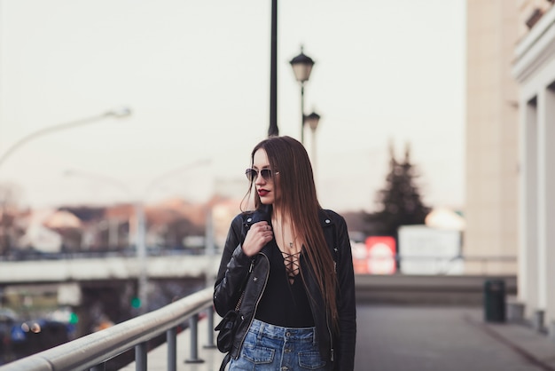 Glamour lady walking in city streets