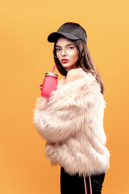 Glamour young woman with drinking jar