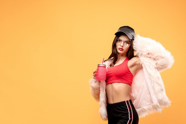 Glamour young woman with drinking jar