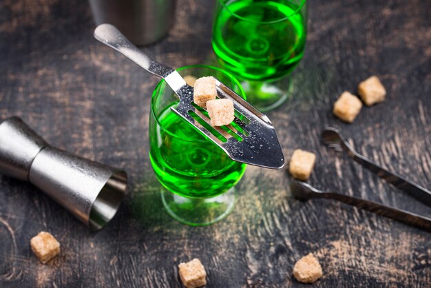 Glass of absinthe with cane sugar