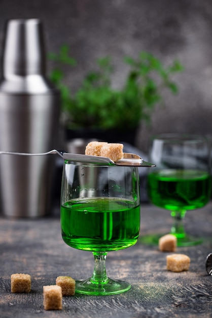 Glass of absinthe with cane sugar