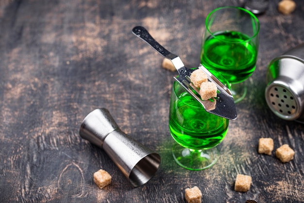 Glass of absinthe with cane sugar