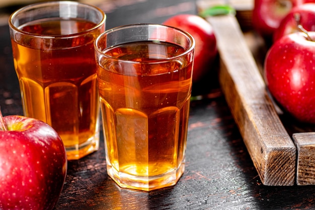 A glass of apple juice on the table