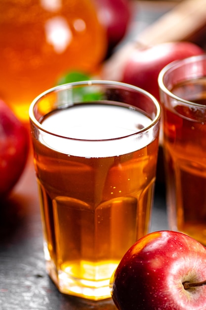 A glass of apple juice on the table