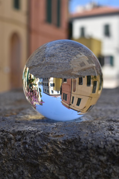 A glass ball with houses on it