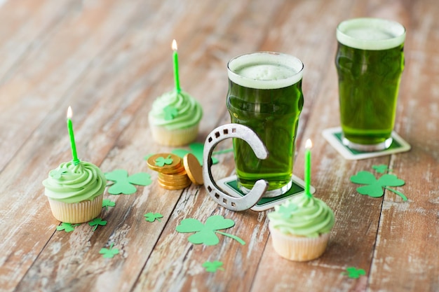 glass of beer cupcakes horseshoe and gold coins