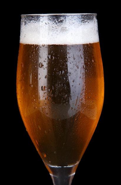 Glass of beer isolated on black