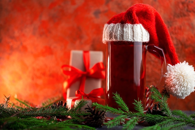 Glass beer mug in Santa Christmas hat