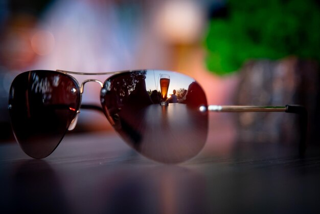 a glass of beer reflection in glasses depth of field