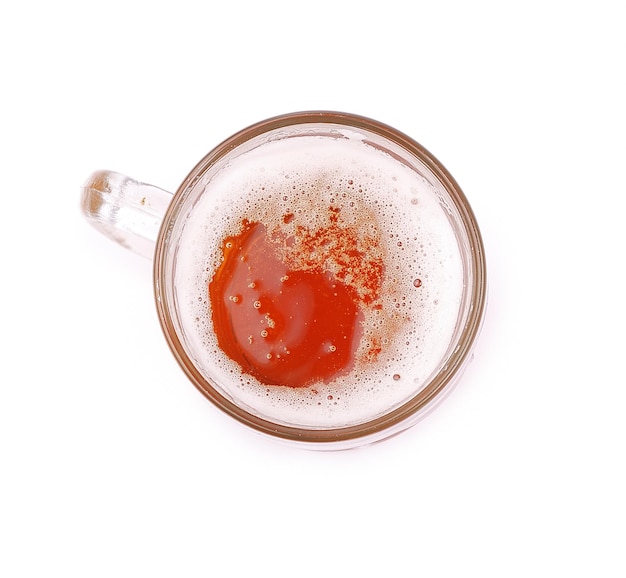 glass of beer on a white background, top view