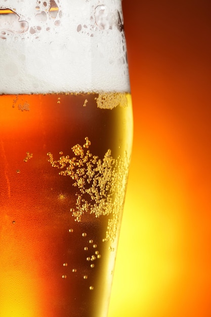 Glass of beer with froth close-up