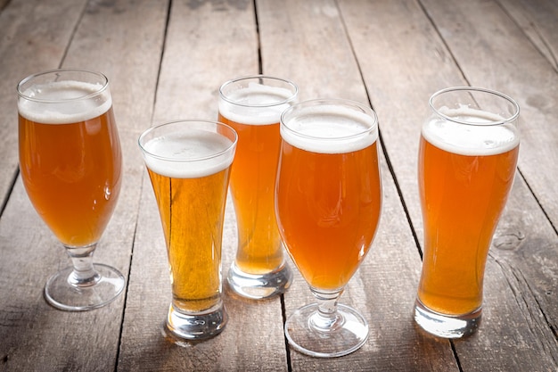 Glass beer on wood background