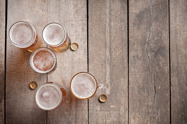 Glass beer on wood background