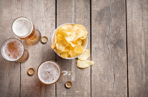 Glass beer on wood background