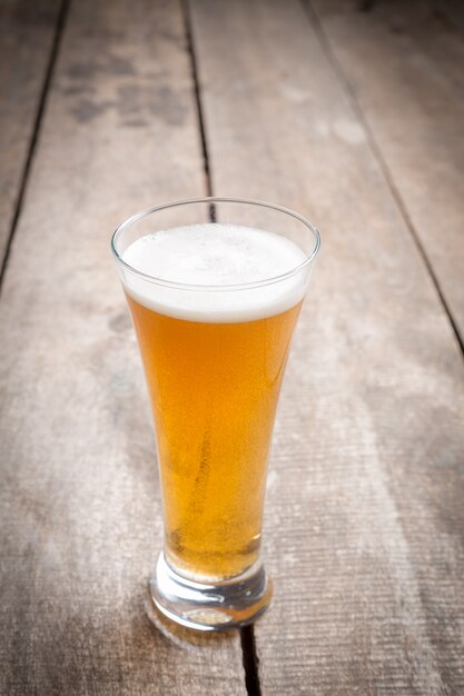 Glass beer on wood  