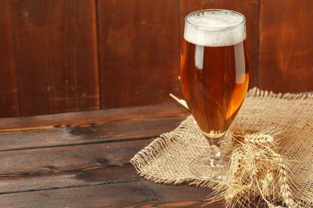 Glass beer on wooden table