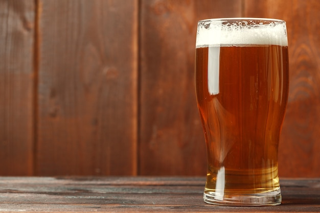 Glass beer on wooden table