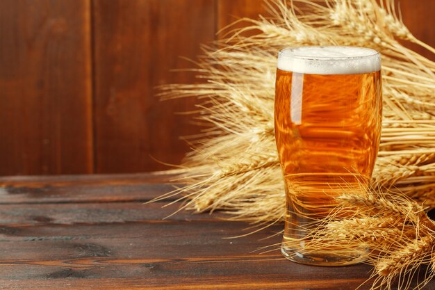 Glass beer on wooden table