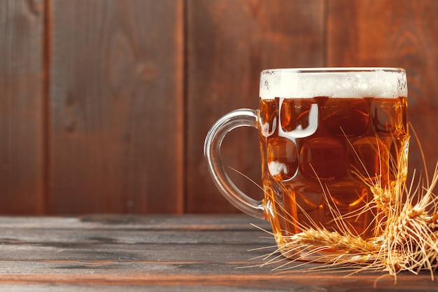 Glass beer on wooden table