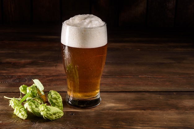 Glass beer on wooden table 