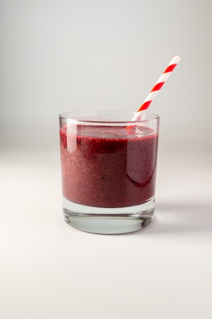 Glass of berry smoothie in a glass Strawberry banana blueberry healthy drink