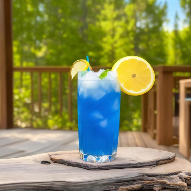 A glass of blue red pink mocktail smoothie cocktail with a mountain view