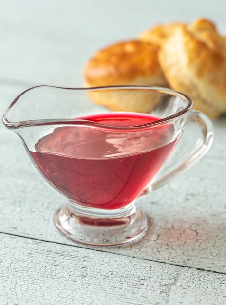 Glass boat of red currant jam