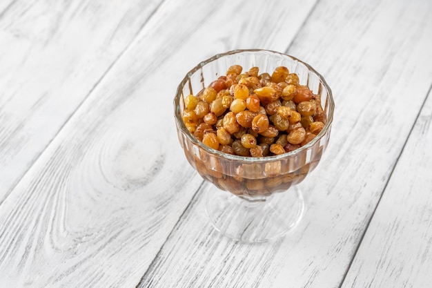 Glass of boerenjongens  raisins soaked in brandy  Dutch dessert