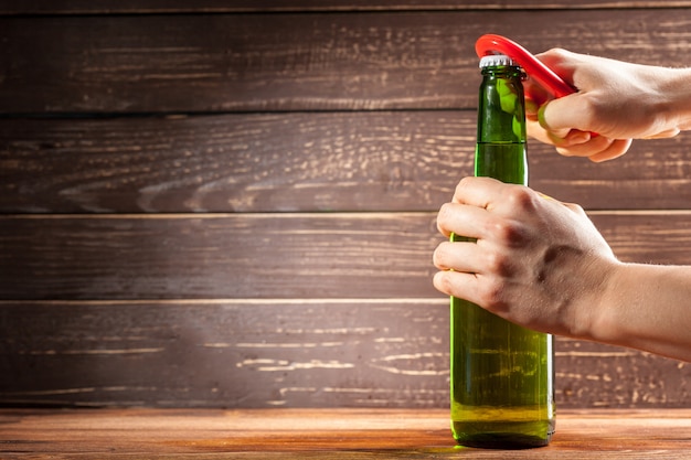 Glass bottle of beer and opener