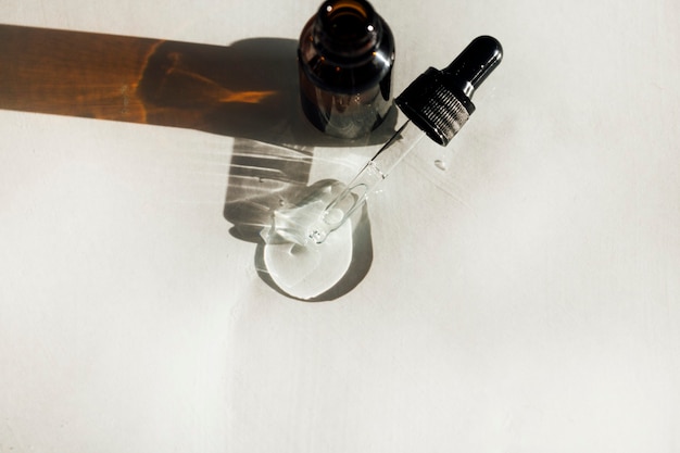 glass bottle of cosmetic serum for the face