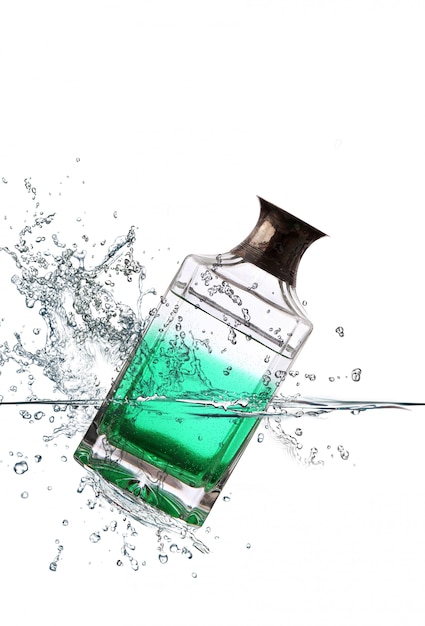 Glass bottle falling in water