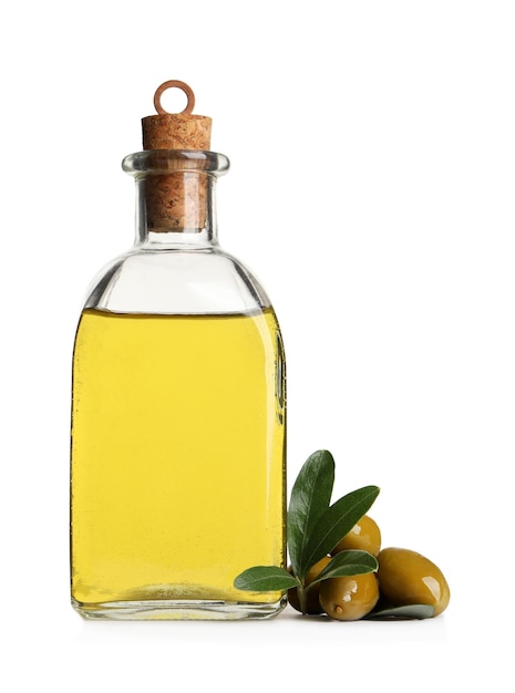 Glass bottle of oil ripe olives and green leaves on white background