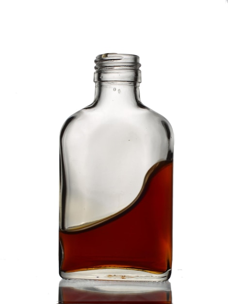 A glass bottle with amount of brown color