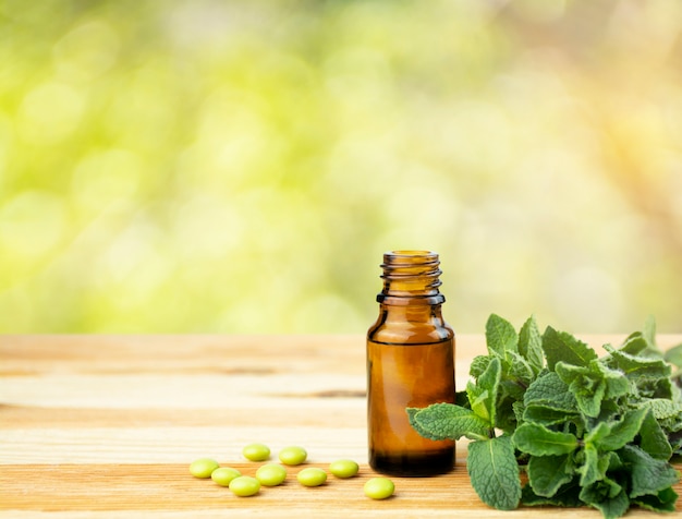 Photo glass bottle with fresh mint leaves