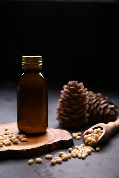 Glass bottle with oil and cedar nuts