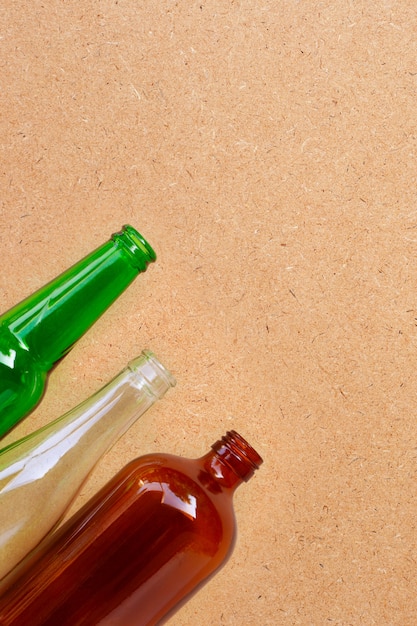 Glass bottles on plywood background.