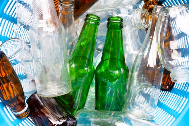 Glass bottles in waste basket.