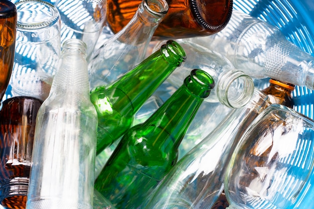 Glass bottles in waste basket.