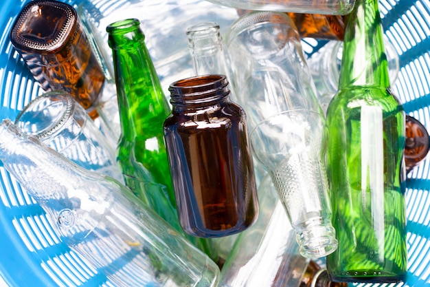 Glass bottles in waste basket.