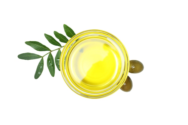 Glass bowl of olive oil isolated on white surface