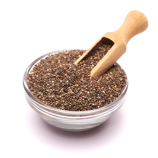 Glass bowl of organic natural chia seeds closeup isolated