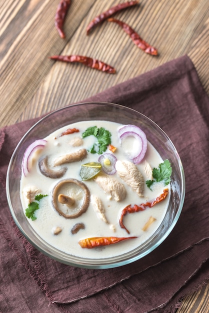 Glass bowl of thai tom kha kai soup