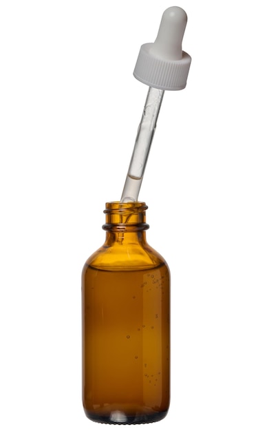 A glass brown bottle with a dropper on a white isolated background a container for cosmetic products