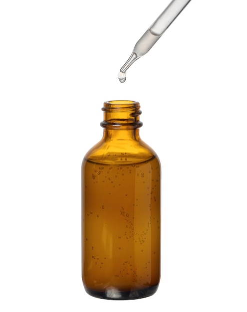 A glass brown bottle with a dropper on a white isolated background a container for cosmetic products